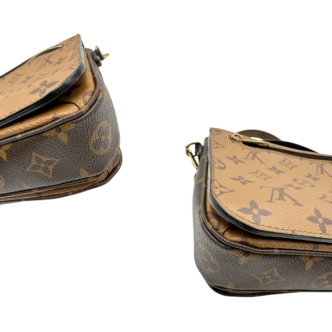 angoli  Borsa LV Métis in canvas marrone monogram reverse con parti metalliche dorate; Indossabile a mano oppure a tracolla. Originale, usata, di lusso, in ottime condizioni.  