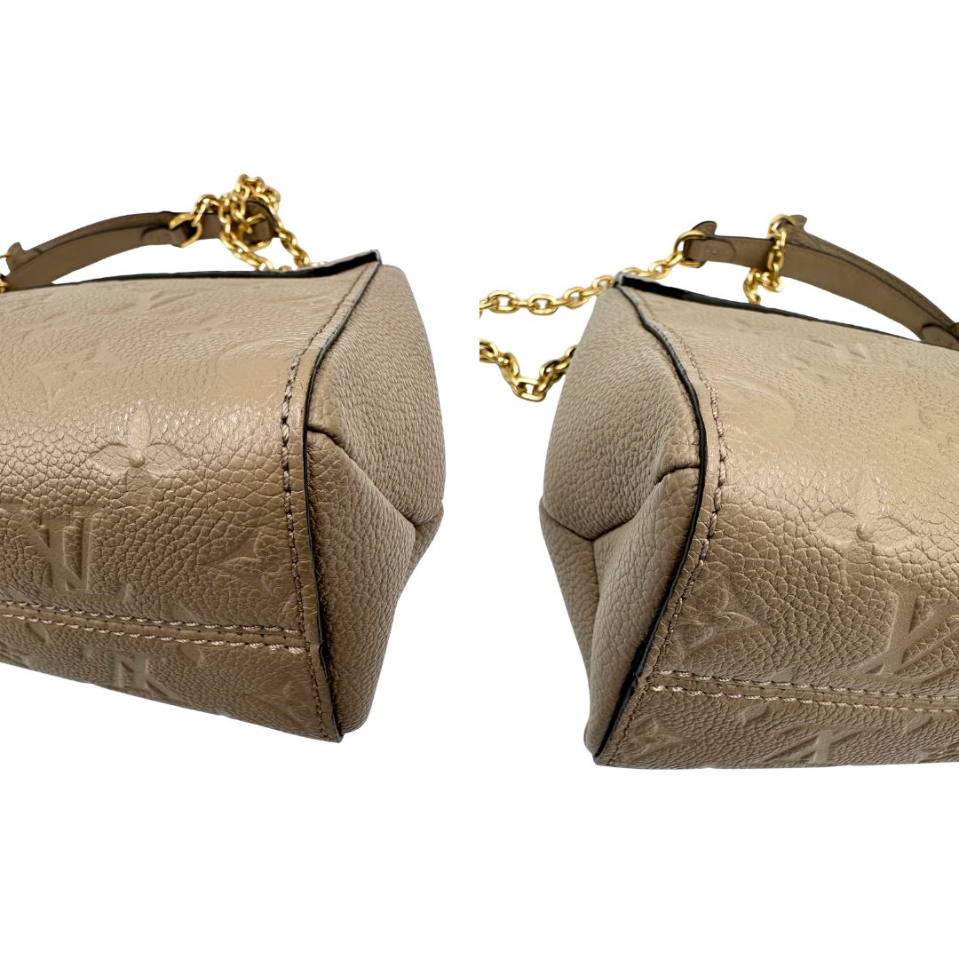 Angoli, Borsa Vavin LV in pelle color fango monogram Empreinte, munita di una tracolla scorrevole con spallacci in pelle.