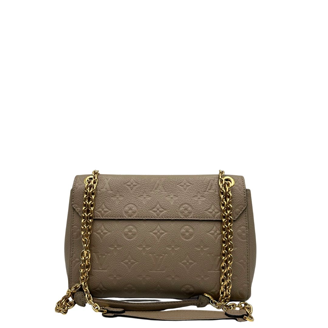 Retro, Borsa Vavin LV in pelle color fango monogram Empreinte, munita di una tracolla scorrevole con spallacci in pelle.