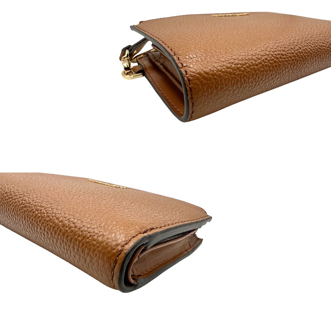 Portafoglio MK in pelle martellata marrone, di lusso, originale, ottime condizioni, usata.