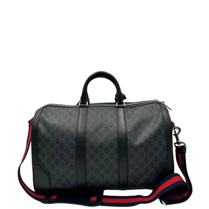 Retro, Borsone da viaggio Gucci Savoy misura piccola in canvas GG supreme nero con parti metalliche argentate, da portare a mano oppure a spalla. Originale, usato, di lusso, in ottime condizioni.