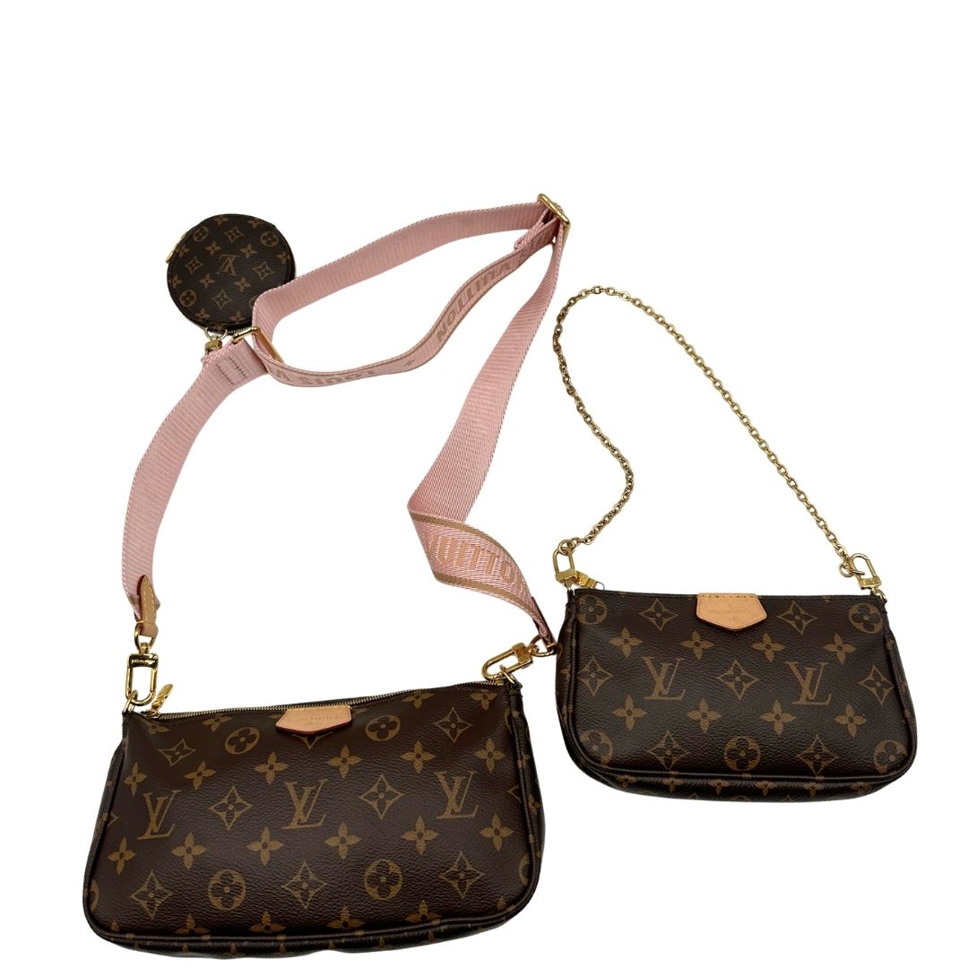 Multi Pochette Accessoires Louis Vuitton in canvas marrone monogram con dettagli in vacchetta naturale, manico in catena dorata e tracolla in tessuto Jacquard rosa, di lusso, originale, ottime condizioni, usata. 