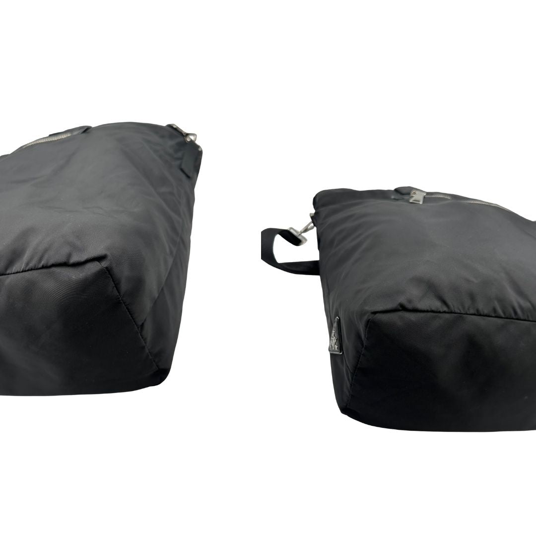 Angoli, Borsa Prada double face in nylon e pelle nero con parti metalliche argentate; munita di doppi manici e una tracolla in tessuto amovibile e regolabile. Originale, usata, di lusso, in ottime condizioni.