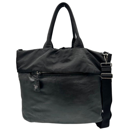 Front, Borsa Prada double face in nylon e pelle nero con parti metalliche argentate; munita di doppi manici e una tracolla in tessuto amovibile e regolabile. Originale, usata, di lusso, in ottime condizioni.