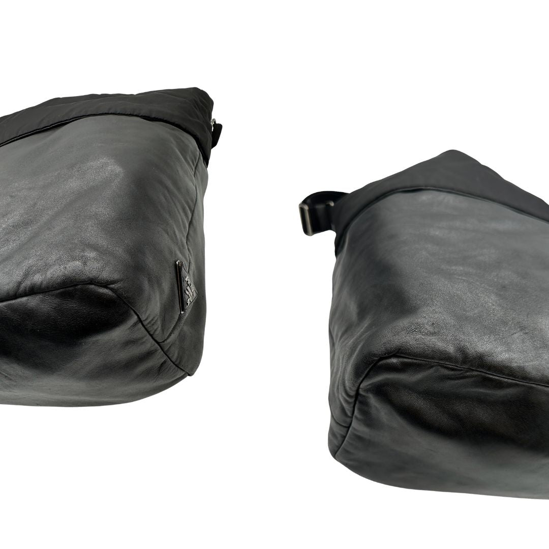 Angoli, Borsa Prada double face in nylon e pelle nero con parti metalliche argentate; munita di doppi manici e una tracolla in tessuto amovibile e regolabile. Originale, usata, di lusso, in ottime condizioni.