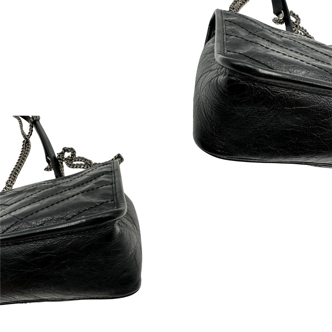 angoli Borsa Niki Saint Laurent nera nella versione baby, di lusso, originale, ottime condizioni, usata. 