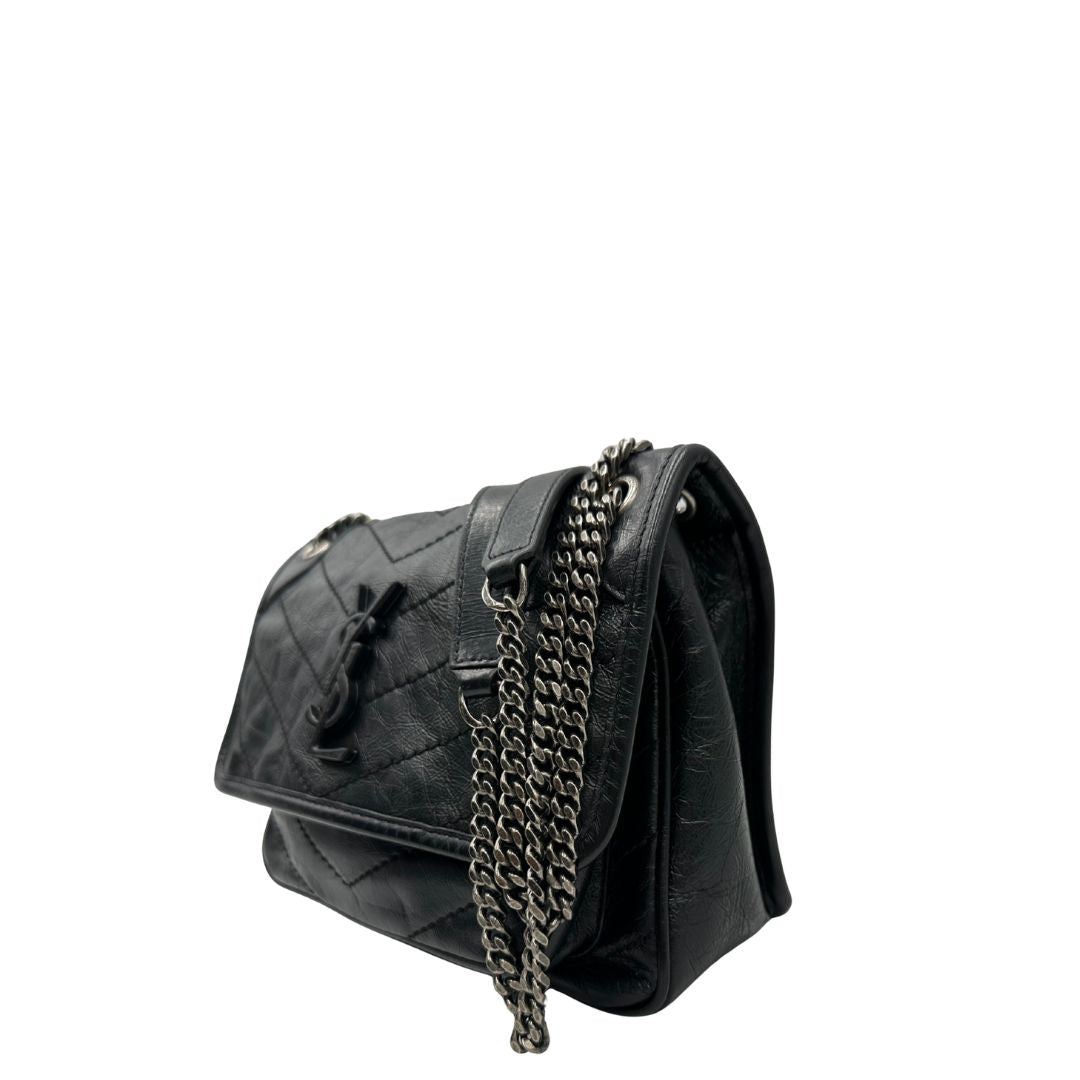 lato Borsa Niki Saint Laurent nera nella versione baby, di lusso, originale, ottime condizioni, usata. 