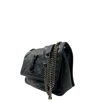 lato Borsa Niki Saint Laurent nera nella versione baby, di lusso, originale, ottime condizioni, usata. 