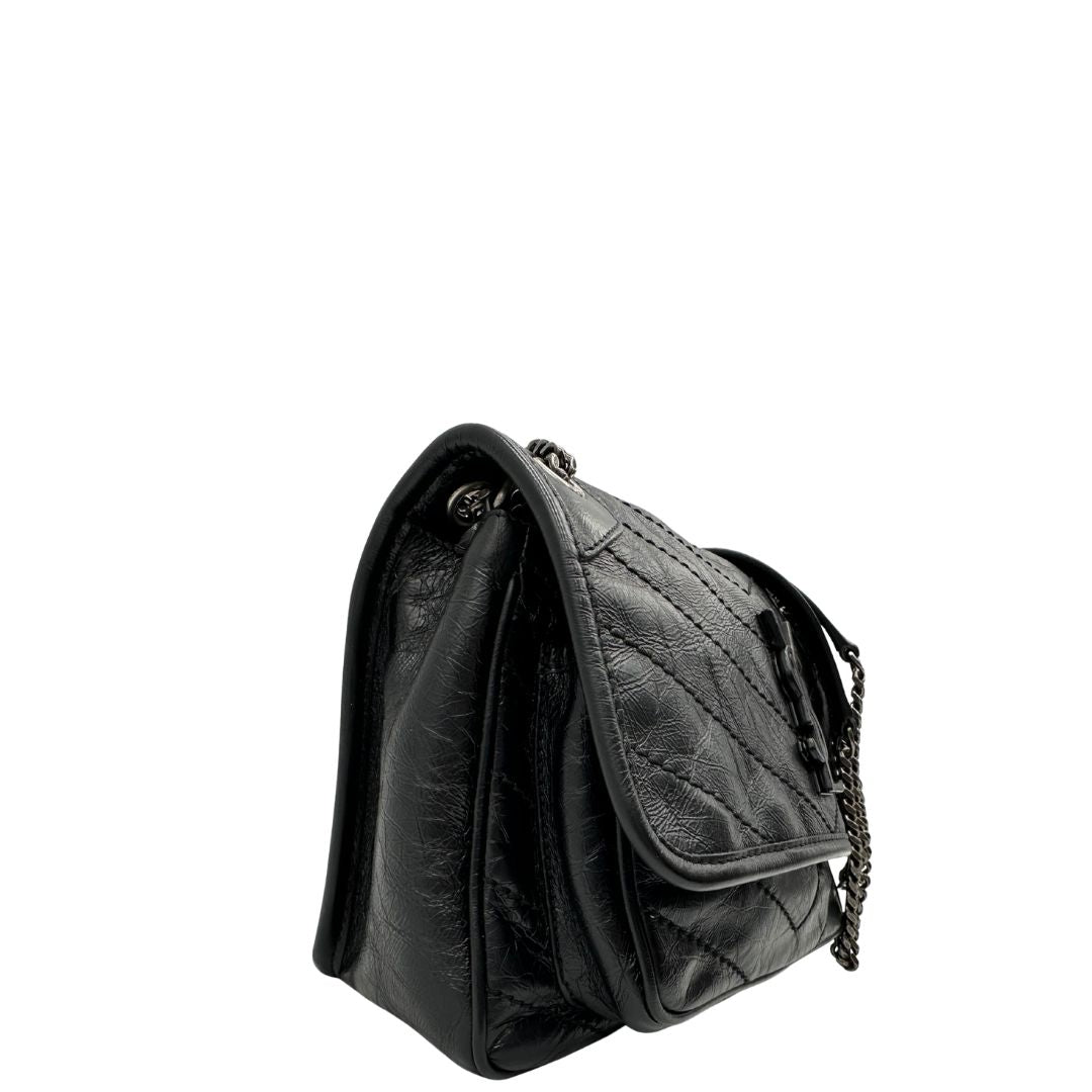 lato Borsa Niki Saint Laurent nera nella versione baby, di lusso, originale, ottime condizioni, usata. 