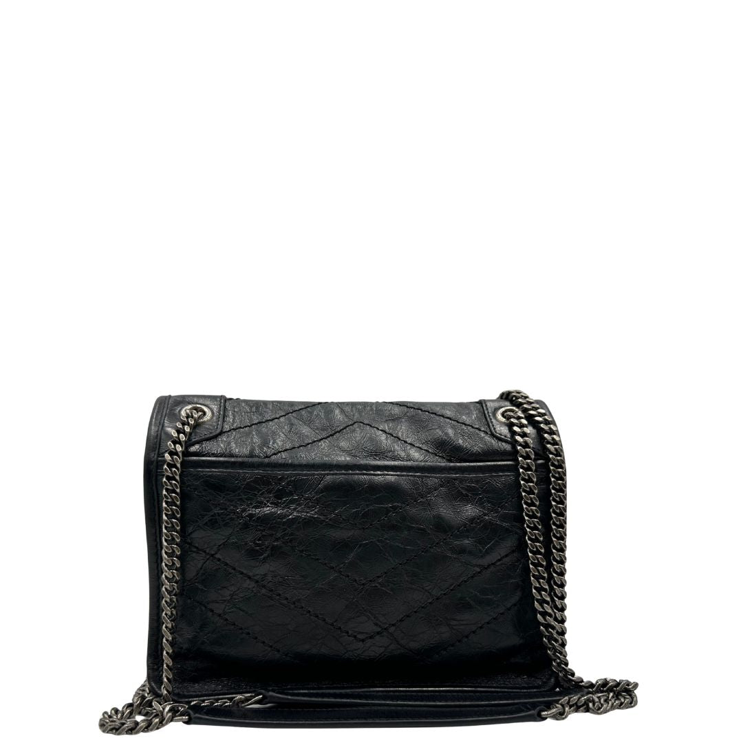 retro Borsa Niki Saint Laurent nera nella versione baby, di lusso, originale, ottime condizioni, usata. 