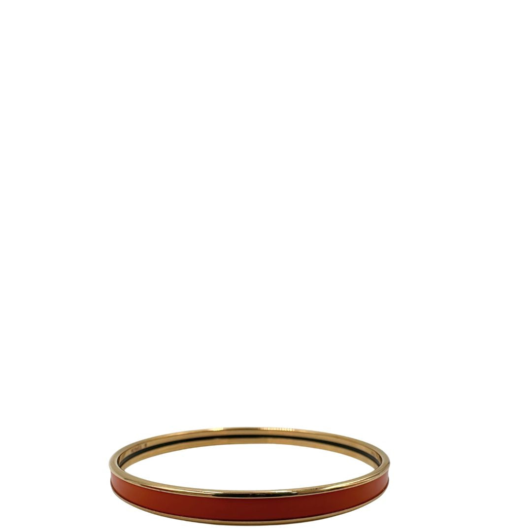  Bracciale Hermès in metallo placcato in oro giallo e smalto arancione, di lusso, originale, eccellenti condizioni, usato.