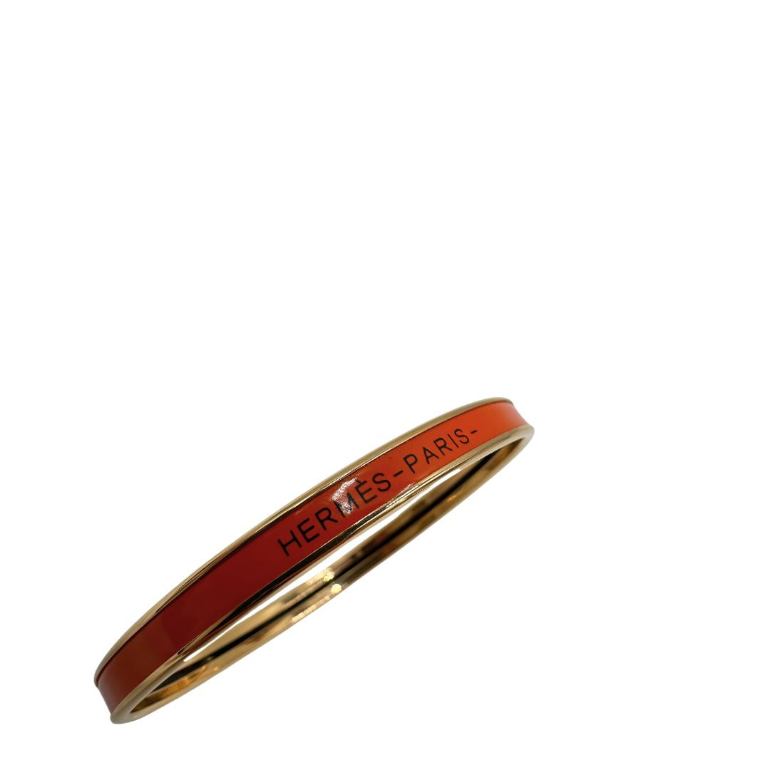 Bracciale Hermès in metallo placcato in oro giallo e smalto arancione, di lusso, originale, eccellenti condizioni, usato.