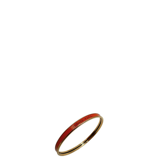  Bracciale Hermès in metallo placcato in oro giallo e smalto arancione, di lusso, originale, eccellenti condizioni, usato.