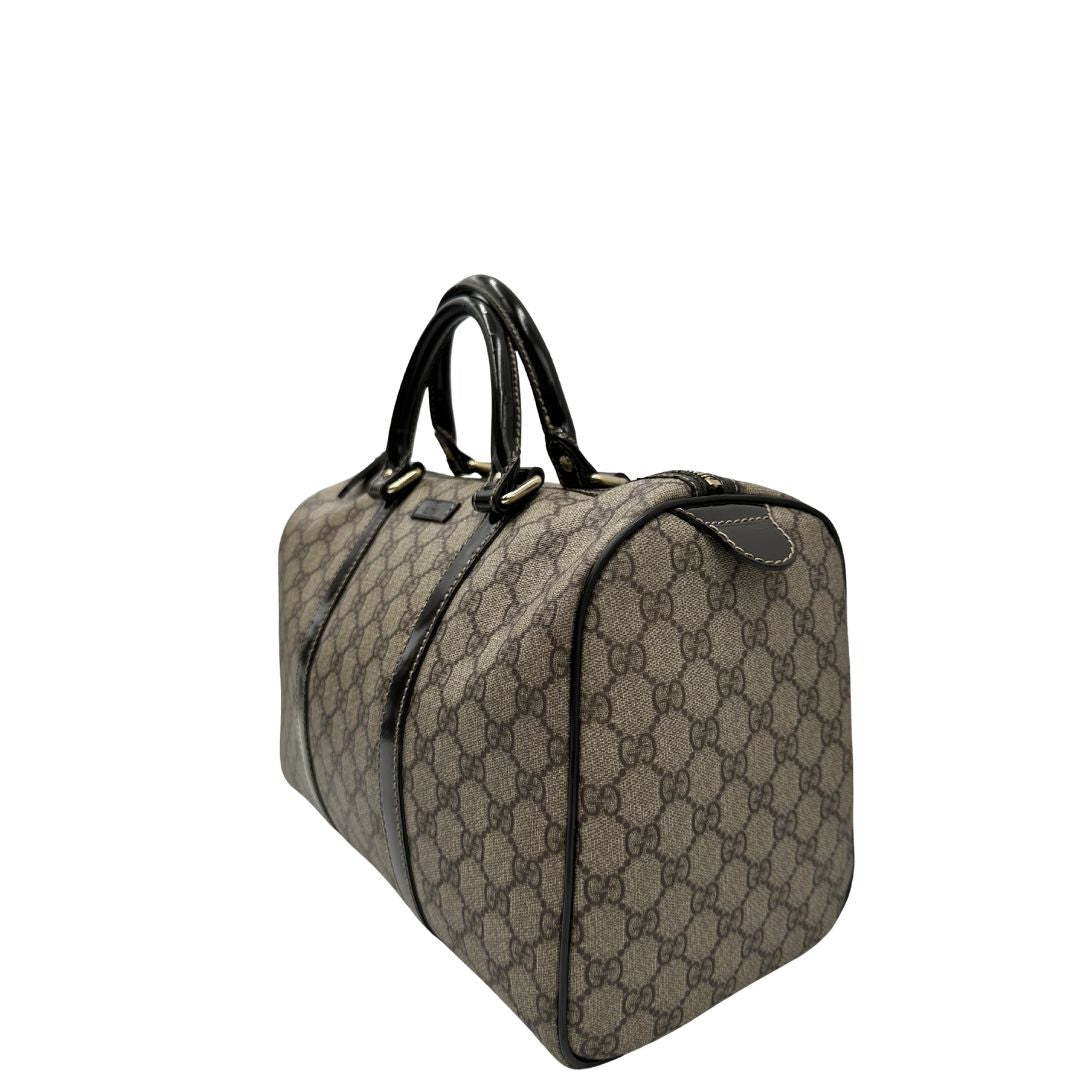 lato Bauletto Gucci GG con finiture in pelle marroni, di lusso, originale, ottime condizioni, usato. 