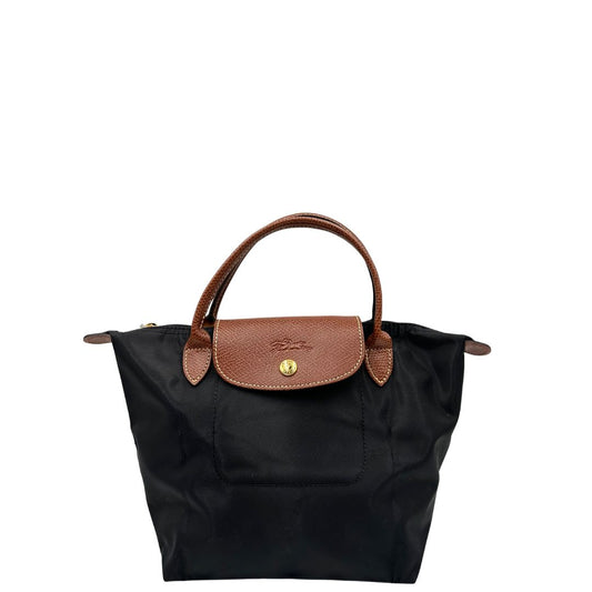 Front, Borsa Longchamp richiudibile in tessuto nylon nero con finiture in pelle nocciola. Parti metalliche dorate. Originale, usata, di lusso, in condizioni eccellenti.