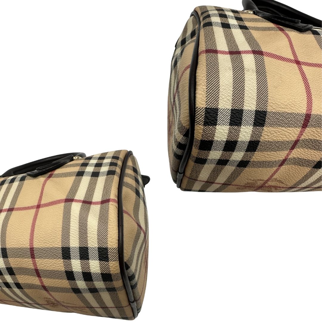 Angoli di un bauletto Burberry in canvas tartan e finiture in pelle testa di moro, usato, originale, second hand, in ottime condizioni.
