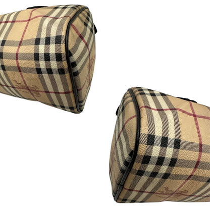 Angoli di un bauletto Burberry in canvas tartan e finiture in pelle testa di moro, usato, originale, second hand, in ottime condizioni.