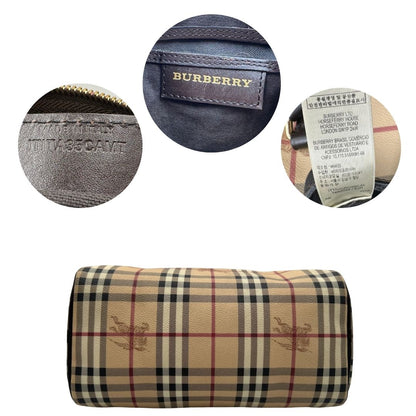 Base e codice di un bauletto Burberry in canvas tartan e finiture in pelle testa di moro, usato, originale, second hand, in ottime condizioni.