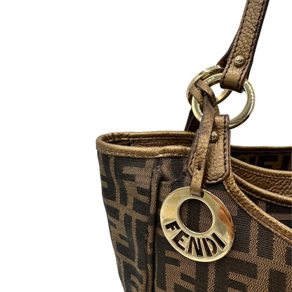 Shopper Fendi in tessuto trama Zucca e finiture in pelle color bronzo, di lusso, originale, ottime condizioni, usata. 