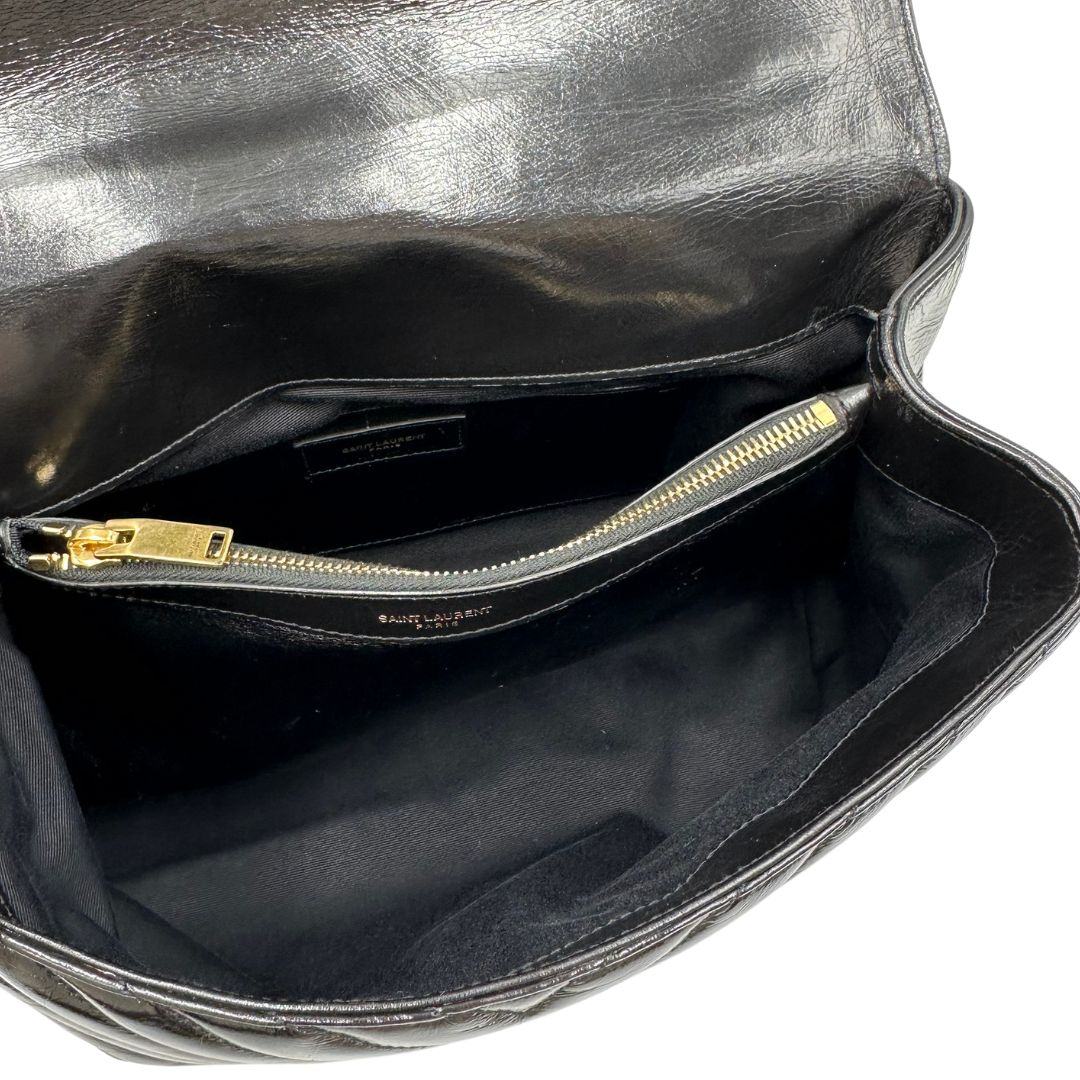 interno  Borsa Saint Laurent in pelle nera con logo Cassandre sul front, di lusso, originale, ottime condizioni, usata. 