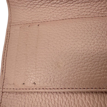 Portafoglio Coccinelle in pelle martellata rosa, di lusso, originale, ottime condizioni, usato.
