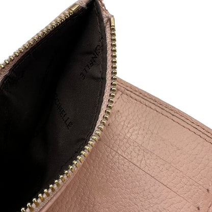 Portafoglio Coccinelle in pelle martellata rosa, di lusso, originale, ottime condizioni, usato.