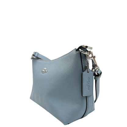 lato Borsa Coach in pelle martellata color azzurro polvere, puoi portarla comodamente a spalla, a tracolla o a mano, di lusso, originale, ottime condizioni, usata. 