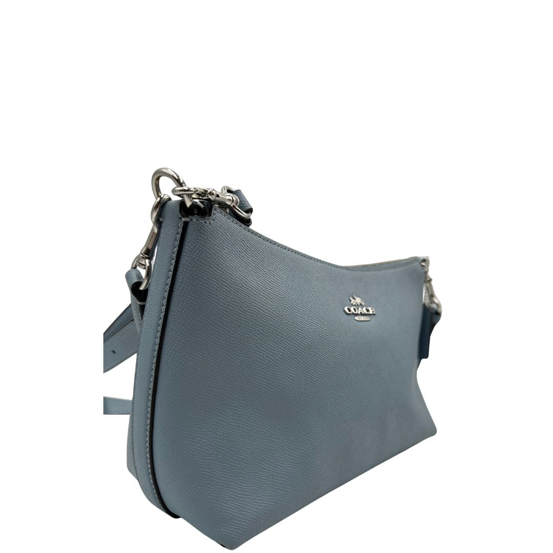 lato Borsa Coach in pelle martellata color azzurro polvere, puoi portarla comodamente a spalla, a tracolla o a mano, di lusso, originale, ottime condizioni, usata. 