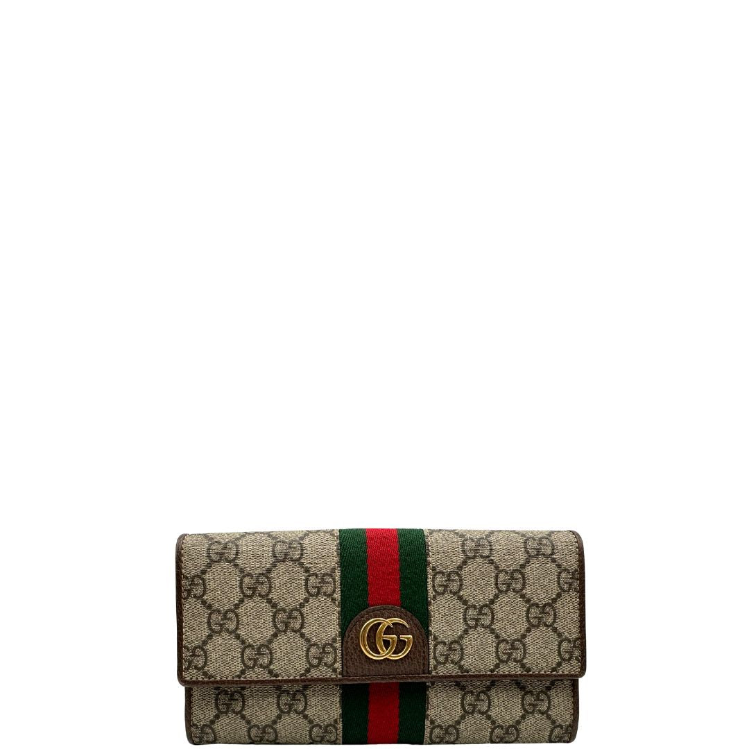 front Portafoglio Gucci in canvas beige GG con iconica striscia Web, sul retro presenta stampa Disney, di lusso, originale, ottime condizioni, usato. 