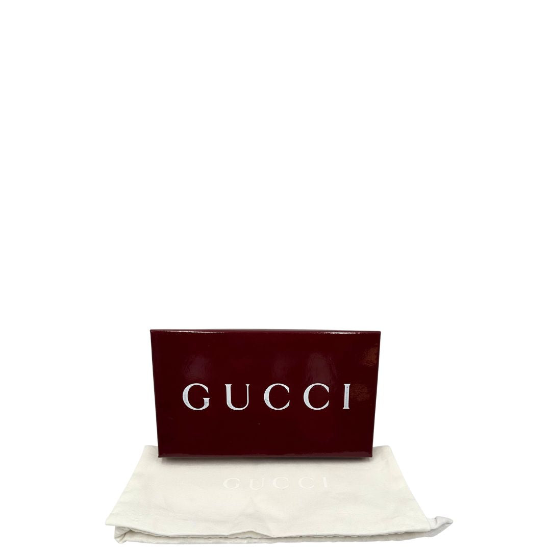 corredo Portafoglio Gucci in canvas beige GG con iconica striscia Web, sul retro presenta stampa Disney, di lusso, originale, ottime condizioni, usato. 