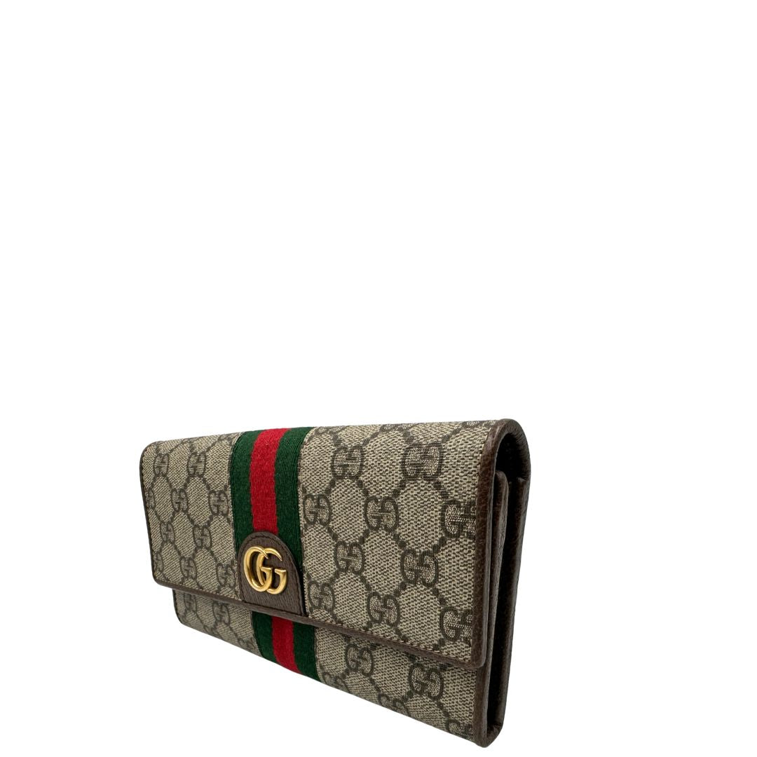 Portafoglio Gucci in canvas beige GG con iconica striscia Web, sul retro presenta stampa Disney, di lusso, originale, ottime condizioni, usato.