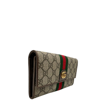lato Portafoglio Gucci in canvas beige GG con iconica striscia Web, sul retro presenta stampa Disney, di lusso, originale, ottime condizioni, usato. 