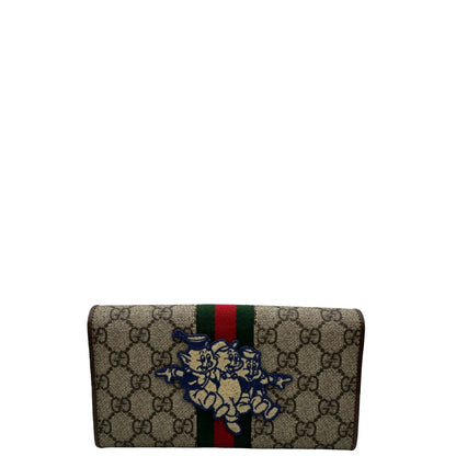 Portafoglio Gucci in canvas beige GG con iconica striscia Web, sul retro presenta stampa Disney, di lusso, originale, ottime condizioni, usato.
