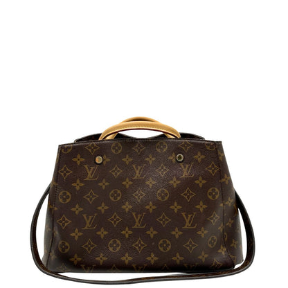 Retro, Borsa Louis Vuitton Montaigne nella versione media in canvas marrone e hardware dorato, indossabile a mano oppure a spalla. Originale, usata, di lusso, in ottime condizioni.