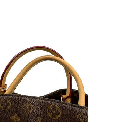 Manici, Borsa Louis Vuitton Montaigne nella versione media in canvas marrone e hardware dorato, indossabile a mano oppure a spalla. Originale, usata, di lusso, in ottime condizioni.