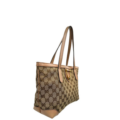 Laterale, Shopper Gucci in tessuto beige GG con finiture in pelle rosa. Indossabile a spalla. Originale, usata, di lusso, in ottime condizioni.