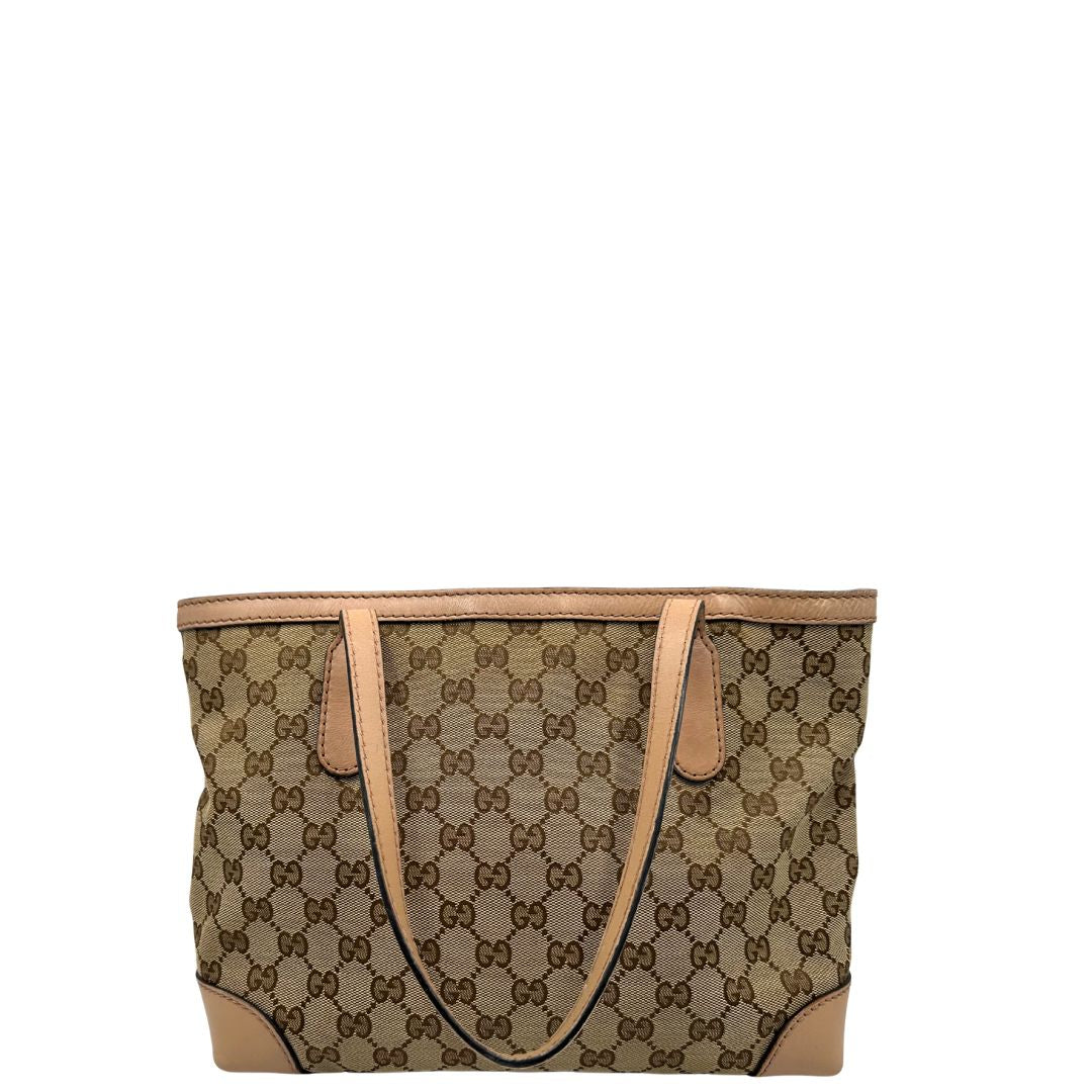 Retro, Shopper Gucci in tessuto beige GG con finiture in pelle rosa. Indossabile a spalla. Originale, usata, di lusso, in ottime condizioni.