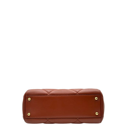 Base di una borsa D&G in pelle trapuntata color terracotta, e hardware dorato, indossabile a mano oppure a tracolla, usata, originale, second hand, in ottime condizioni.