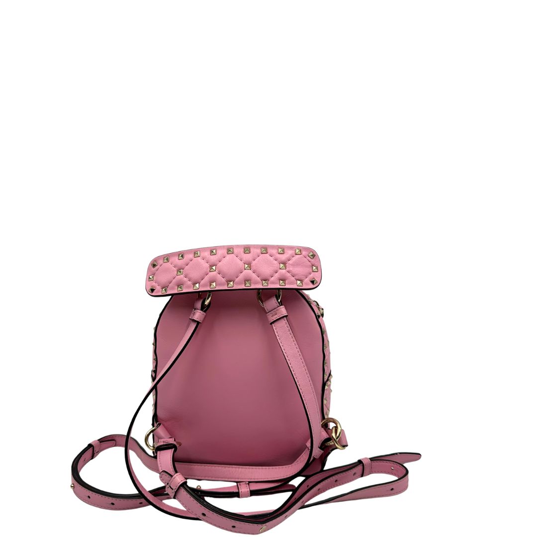 retro Zaino V. G. in pelle rosa impreziosito da borchie piramidali su tutta la superficie, di lusso, originale, ottime condizioni, usato. 