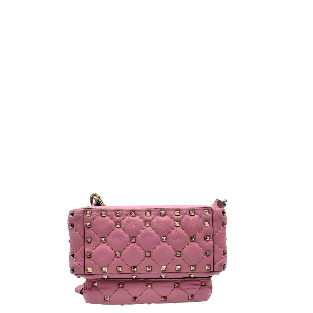 Zaino V. G. in pelle rosa impreziosito da borchie piramidali su tutta la superficie, di lusso, originale, ottime condizioni, usato.