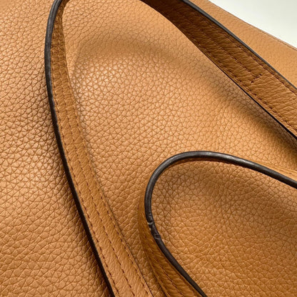 manici borsa MK in pelle martellata color cammello, di lusso, originale, ottime condizioni, usata. 