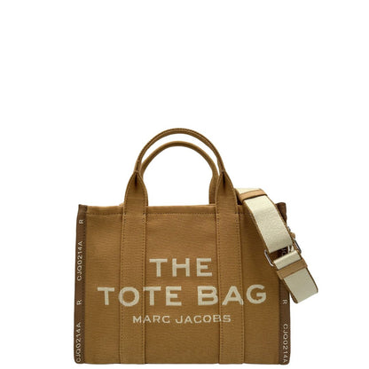 Front, Borsa The Tote Bag Marc Jacobs in tessuto Jacquard con tracolla regolabile e amovibile in tessuto bianco con parti metalliche argentate. Originale, usata, di lusso in condizioni eccellenti.