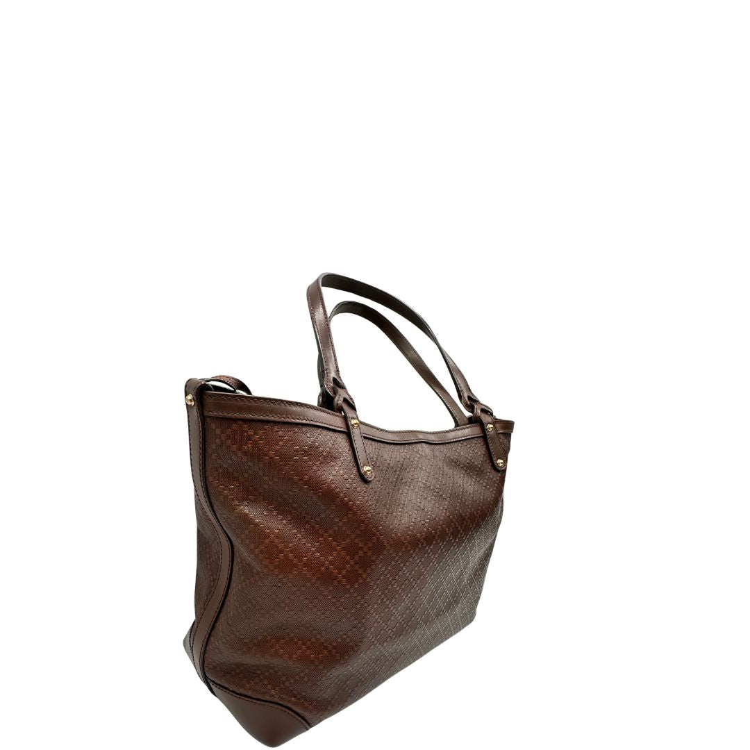 Laterale, Borsa Tote Gucci in pelle marrone cioccolato e hardware dorato, indossabile a spalla. Originale, usata, di lusso, in ottime condizioni.
