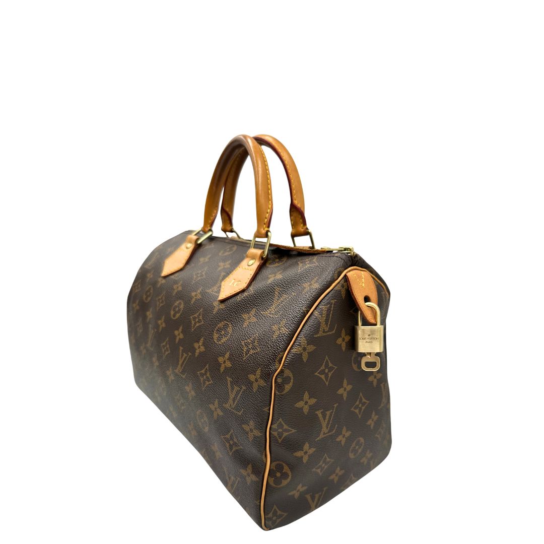 Laterale, Speedy Louis Vuitton monogram nella misura 30. Originale, usato, di lusso, in ottime condizioni.