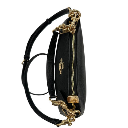 chiusura Borsa Coach in pelle martellata nera, puoi portarla comodamente a spalla, a tracolla o a mano, di lusso, originale, ottime condizioni, usata. 