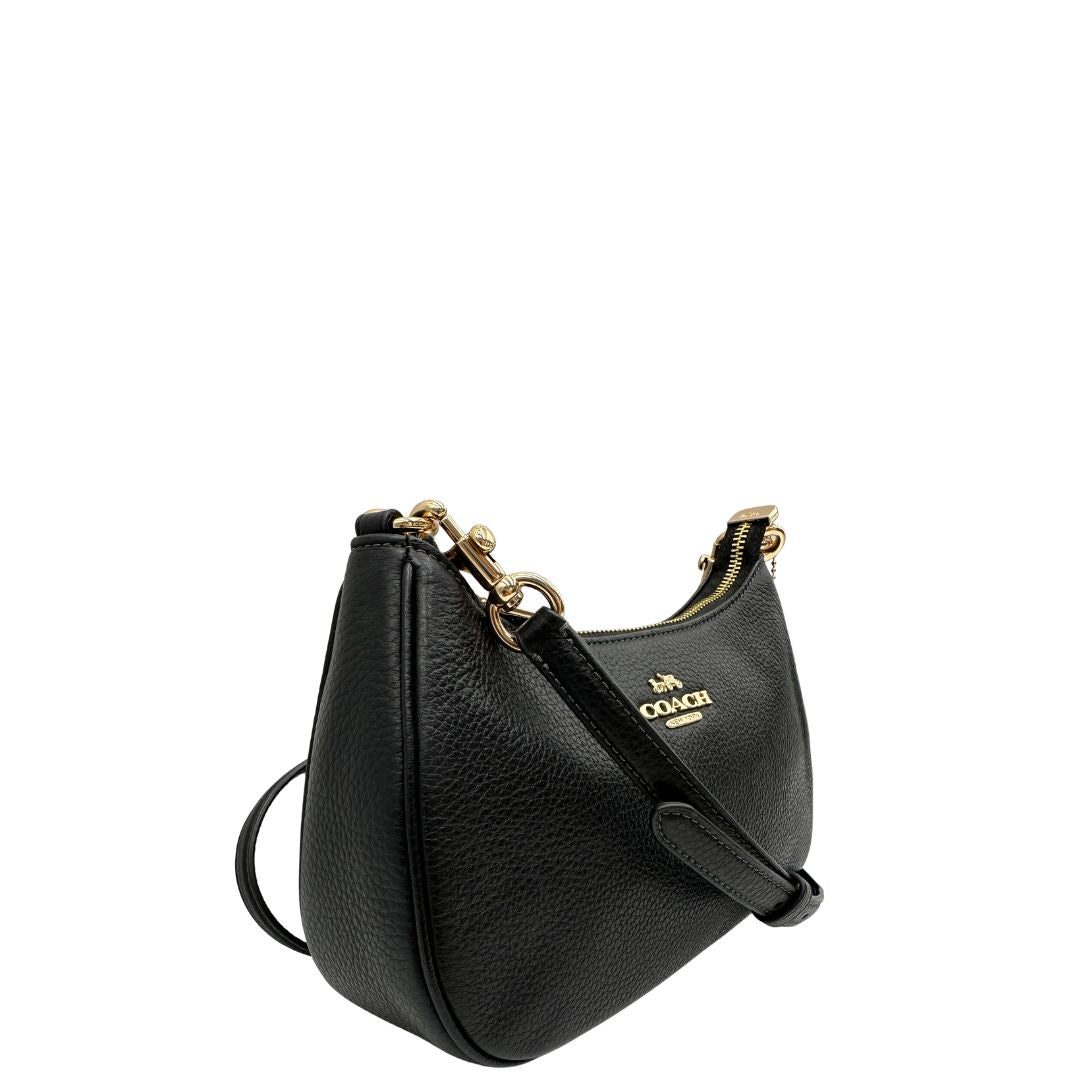 lato Borsa Coach in pelle martellata nera, puoi portarla comodamente a spalla, a tracolla o a mano, di lusso, originale, ottime condizioni, usata. 