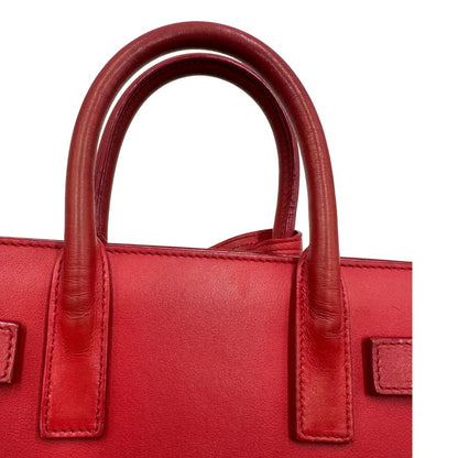 manici Borsa Saint Laurent in pelle rossa, indossabile a tracolla o a mano, di lusso, originale, ottime condizioni. 