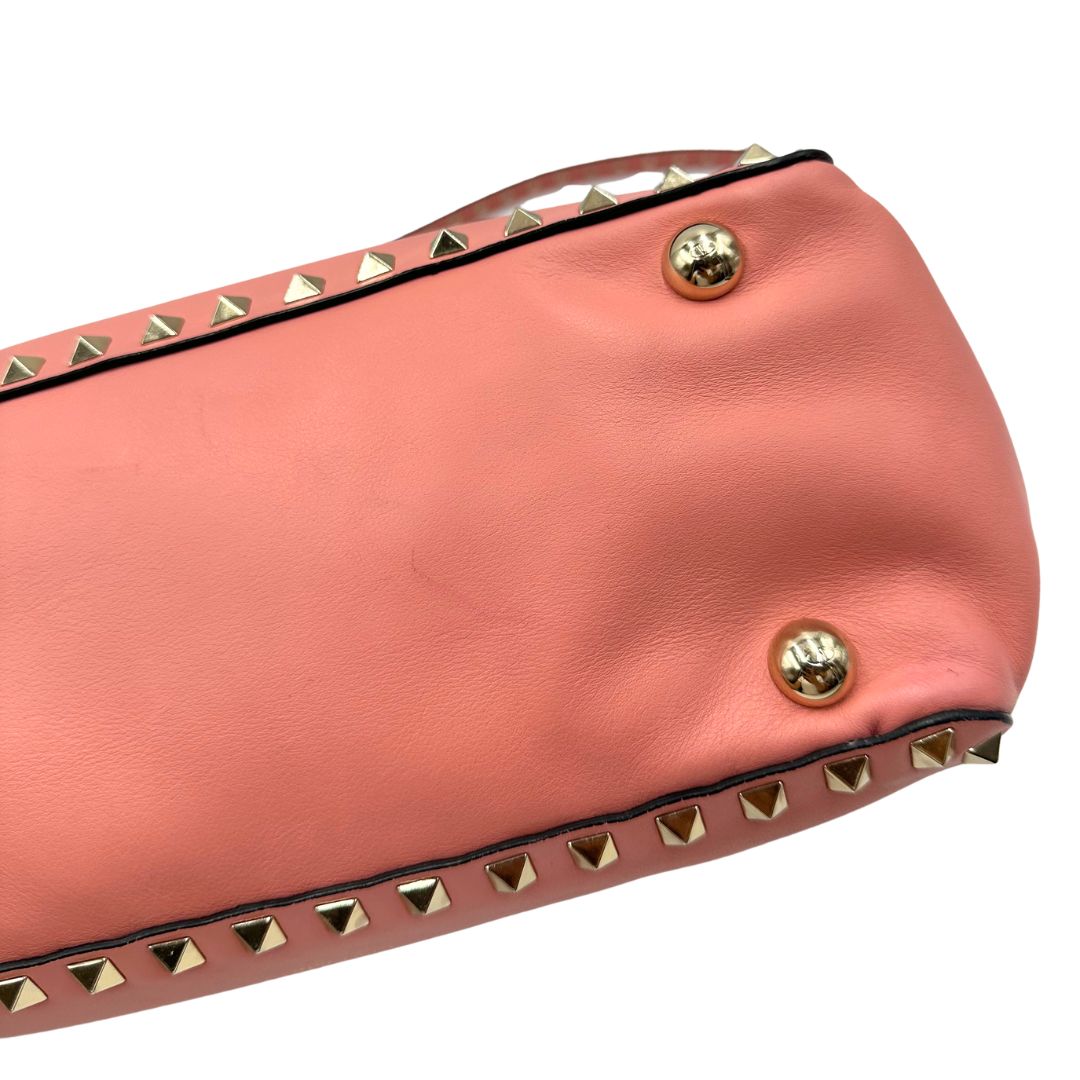 Borsa V. G. in pelle color rosa salmone impreziosita da borchie piramidali, di lusso, originale, ottime condizioni. 