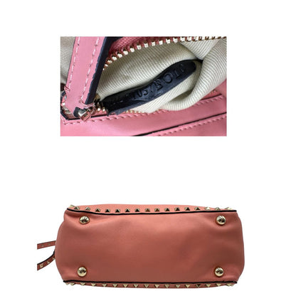 se Borsa V. G. in pelle color rosa salmone impreziosita da borchie piramidali, di lusso, originale, ottime condizioni. 