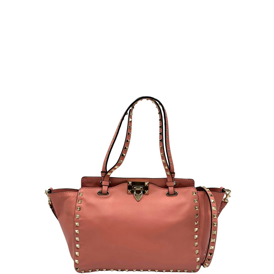 front Borsa V. G. in pelle color rosa salmone impreziosita da borchie piramidali, di lusso, originale, ottime condizioni. 